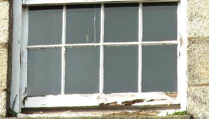Close-up of deterioration to the lower part of a timber window frame